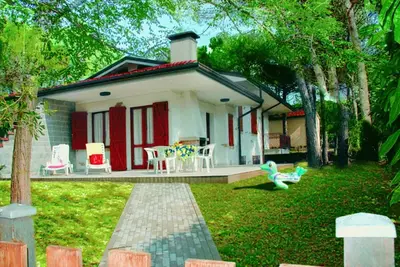 Image de Joli duplex pour 7 personnes dans une oasis de verdure à Lignano Riviera