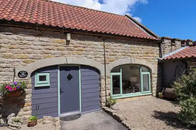 Image de Wayside Farm Stable Cottage, pet friendly, with a garden in Burniston