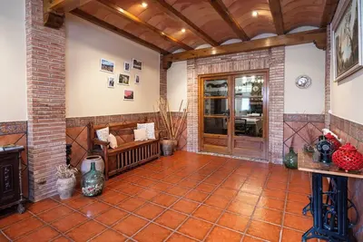 Image de Village house with picnic area and fireplace.