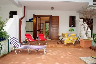 Image de Maison mitoyenne parfaitement équipée avec jardin clôturé pour 8 personnes à Lignano Pineta