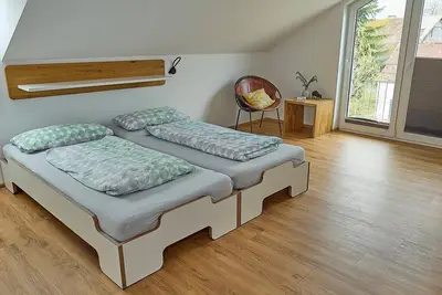 Image de Above the rooftops - cozy attic apartment with mountain view and mini balcony.