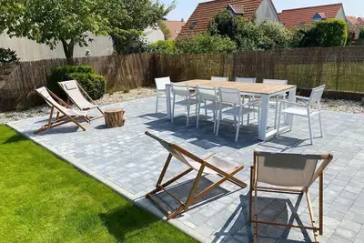 Image de Agréable maison dans un quartier calme avec garage et jardin clôturé.