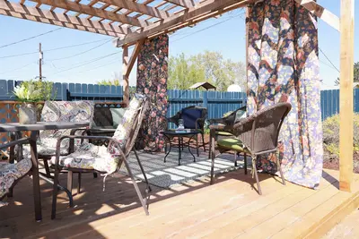 Image de Central Richland home with large pergola deck