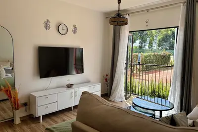 Image de Chic 2-bedroom apartment with WiFi, Pool, Gym, and Power backup in Tatu City