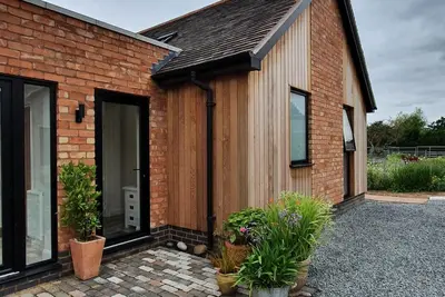 Image de Set within our working flower farm alongside our main barn conversion, The Flower Room annexe is a s
