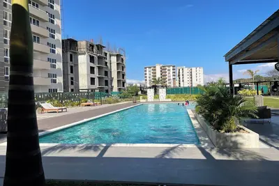Image de Charming 2-bedroom condo with shared pool, gym, Wi-Fi, one parking space