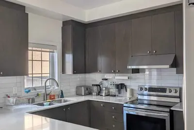 Image de Steps to Heartland Town Centre! Cozy Home with a Huge Backyard