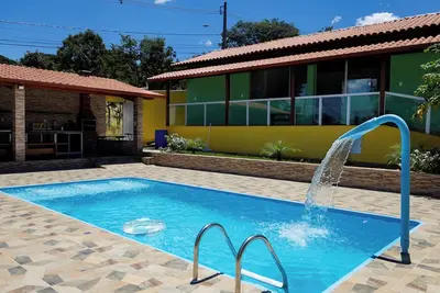 Image de Casa bem equipada com piscina, churrasqueira e WiFi