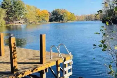 Spacious 4-bedroom waterfront house in Sylvan Beach with private yard and dock.