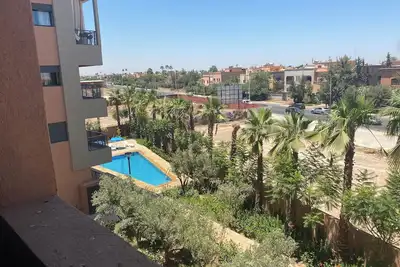 Image de Spacieux Appartement avec Salon Marocain et Balcon à Prestige Targa, Marrakech