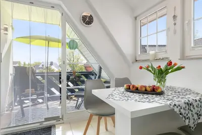 Image de Studio « Gertruds Leuchtturm » près de la plage avec jardin commun, balcon et Wi-Fi