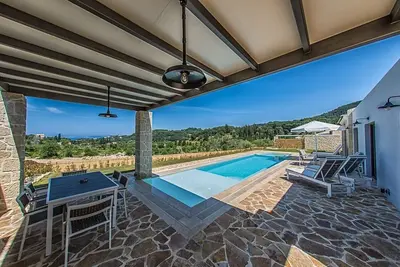 Alluring Corfu Villa | Villa Corallia | 2 Bedrooms | Spacious Furnished Terrace with Shaded Outdoor Dining Area | Private Garden, Pool and Hot Tub | Prime Location | Arillas, Mega Lithari
