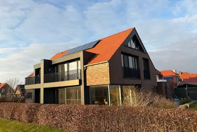 Image de Maison de vacances 'Großzügiges Modernes' avec terrasse partagée, jardin privé et Wi-Fi