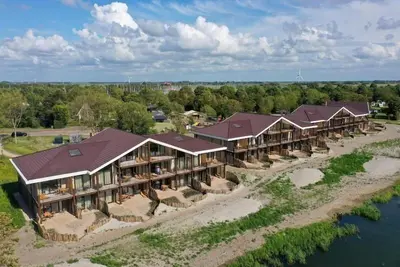 Image de Spacious 6-person apartment with sauna, bathtub, and IJsselmeer view. Perfect for families or friends by the water.