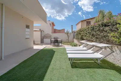 Image de Appartement 'Marzamemi 1 Con Giardino' avec piscine partagée, Wi-Fi et climatisation
