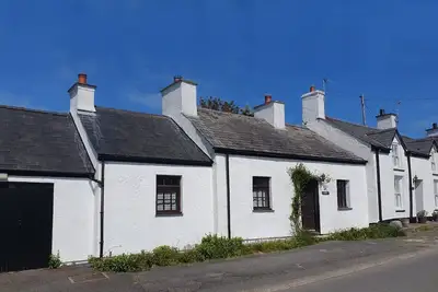 Image de Fisherman’s Cottage by the Beach and Lighthouse
