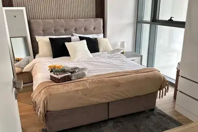 Image de \nIN Abu Dhabi  three-bedroom duplex apartment accommodate 4 people. facilities