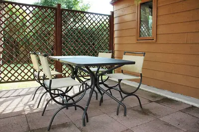 Image de Tiny Home 'Massimo - Minicasa 2' avec vue sur lac, terrasse privée et jardin privé