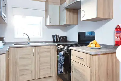 Image de Tastefully decorated with neutral tones and perfect for relaxing evenings.