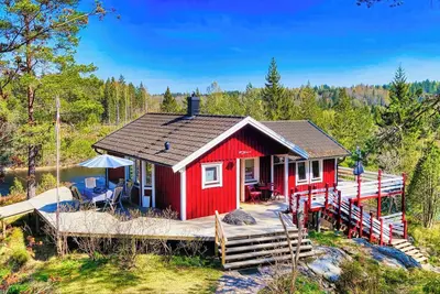 Image de Holiday home Tived - directly on lake, sauna, boat, hot tub