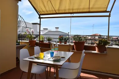 Image de Penthouse overlooking the rooftops of Anzio's historic buildings, downtown but within walking distance of the beach.