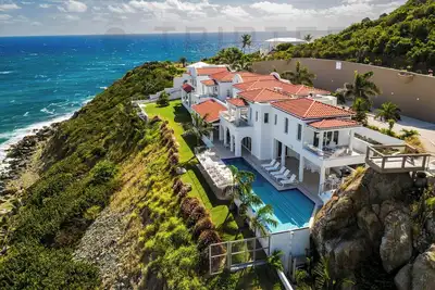 Image de Villa en bord de falaise avec vue sur la mer à Guana Bay - Amalia par Tripter
