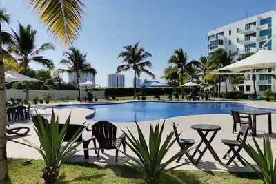 Relax and Work by the Beach – 2br Condo with Pools, WiFi, A/C in Playa Blanca