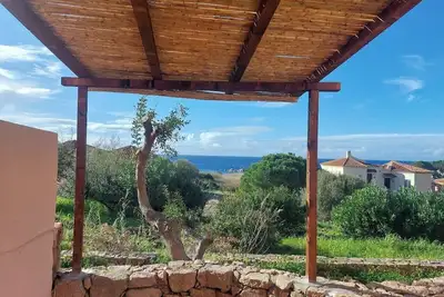 Appartement avec terrasse vue mer dans un village touristique près d'Isola Rossa