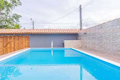 Image de Casa em Bertioga com piscina a 700m da praia