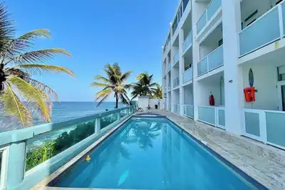 Image de Coastal View: Beach Front Apartment with Pool