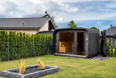 Image de Maison de vacances 'Ferienhaus Am See Mit Sauna' avec terrasse privée, jardin privé et Wi-Fi