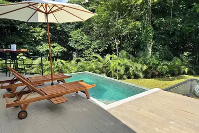 Image de House by the river with an infinity pool, tub, and a bonfire.
