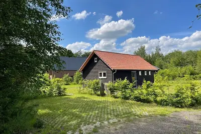 Image de Relax and unwind in this peaceful, cozy and stylish space. The forest cottage is located on the Holiday Park de Kremmer in Gasselte, in the middle of the woods and within walking distance of a beautiful swimming lake. For the cycling enthusiast there