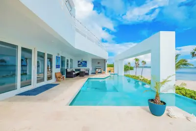 Fox Villa is your private island hideaway, complete with two pools and a boat at your service.