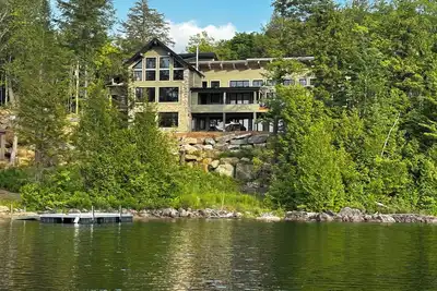 lakefront cottage is where comfort meets nature in perfect harmony.