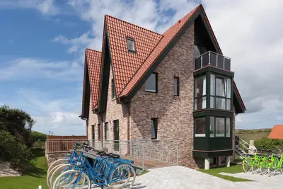 Image de Comfortable vacation home Juist: dune view, 5 bedrooms, 4 bathrooms, guest Wc, fireplace, barbecue