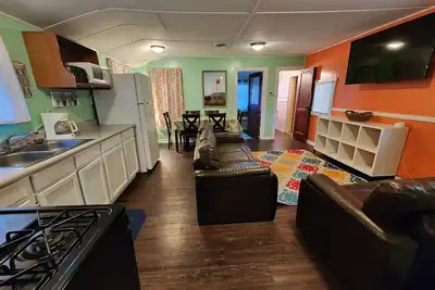 Two Bedroom Cabin - Street & Pool View - Two bedroom cabin conveniently located at Outrigger Resort, right down the road from Indiana Beach Amusement Park! This 600 sq ft classic cabin offers two (2) queen beds and two (2) futons to sleep six (6)! Am