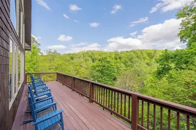 Image de Private lakefront home with dock, forest views, balconies, game room, and cozy indoor charm