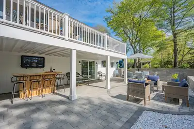 Spacious dog-friendly property featuring a stunning backyard oasis with fire pits and outdoor bar