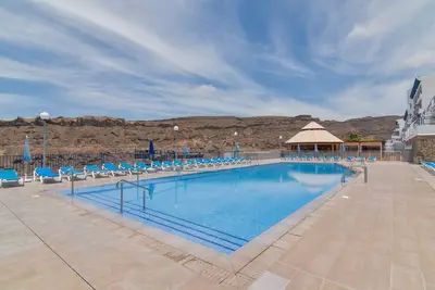 Image de Maison de vacances 'Taurito Big Terrace' avec vue sur la mer, piscine partagée et Wi-Fi