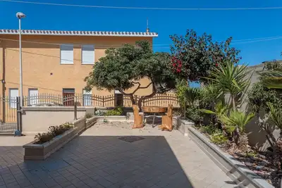 Image de Maison de vacances 'Villetta Al Mare - S'archittu' avec jardin privé, Wi-Fi et climatisation