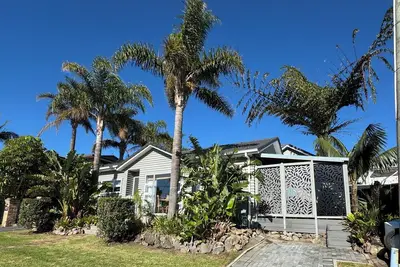 Your coastal escape. Walk to the beach. Private spa, whole house access.