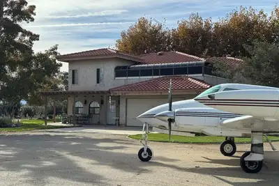 Image de Fabulous Spanish-style home in the country with an aviation theme.