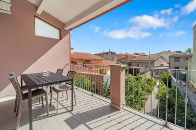 Image de Appartement 'Di Pina' avec terrasse privée, jardin partagé et climatisation