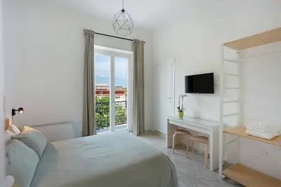 Image de Chambre 'Camera Matrimoniale Pagani' avec Terrasse partagée, Wi-Fi et Climatisation