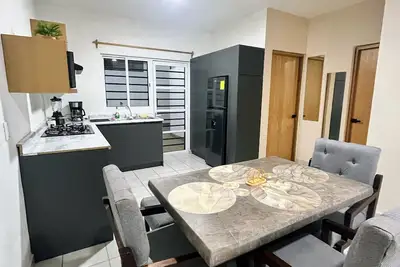 Air-conditioned house, electric gate, covered garage, lovingly decorated.