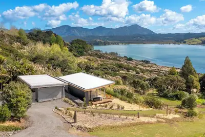 Escape to a private retreat in natures embrace on the tranquil Hokianga Harbour