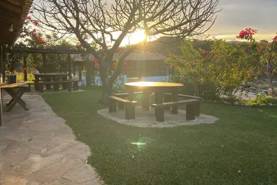 Image de Sítio Água de Trombas Dantas, wonderfully peaceful amidst lush nature.