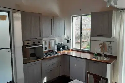 Image de Cottage with large roof terrace directly on the river, within walking distance of the village center.