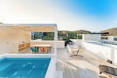 Image de Rooftop Plunge Pool & Surf-Friendly Beach